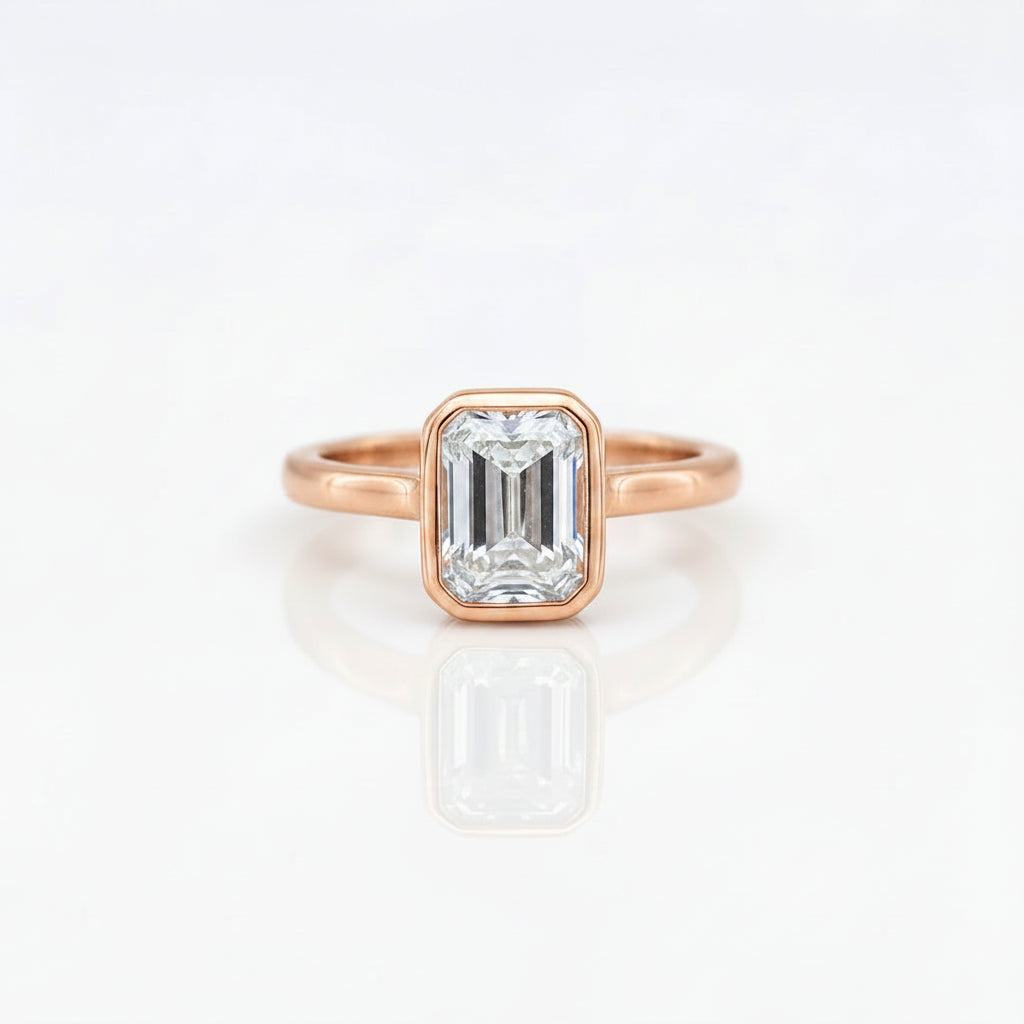Gold Emerald Cut Bezelle Ring