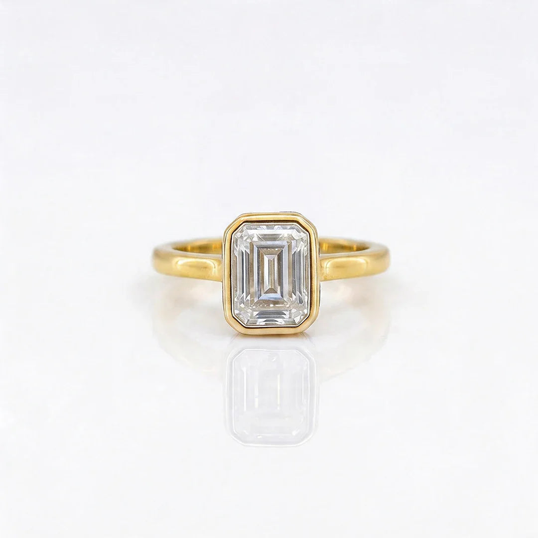 Gold Emerald Cut Bezelle Ring